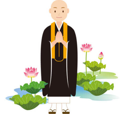 合掌をしながら微笑んでいる仏教僧侶